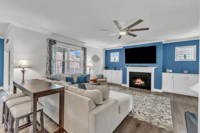 a living room with furniture or couch and a large window