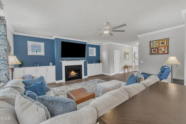 a living room with furniture and kitchen view