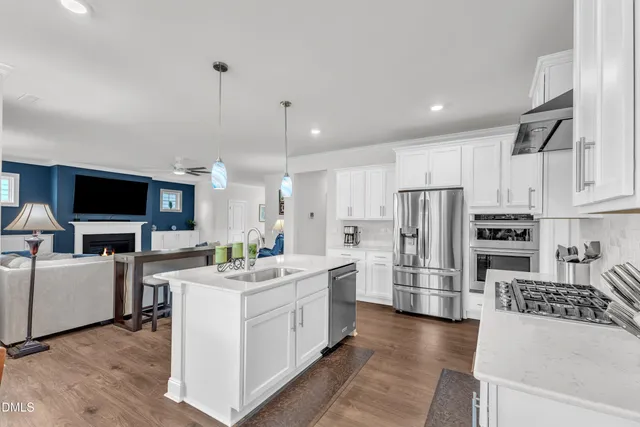 a kitchen with sink and cabinets