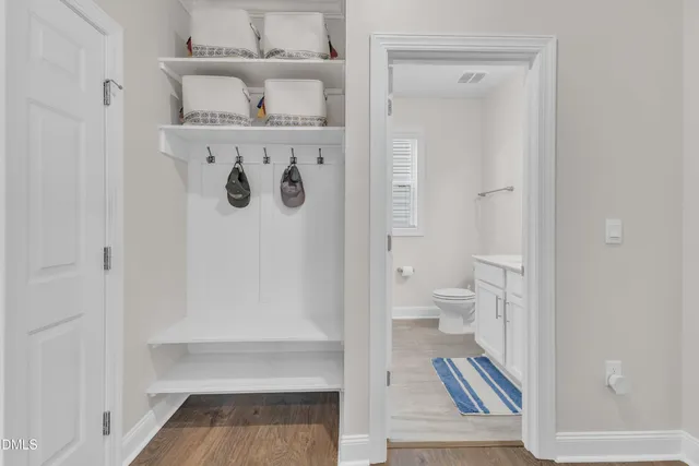 a kitchen with stainless steel appliances kitchen island refrigerator stove microwave and cabinets