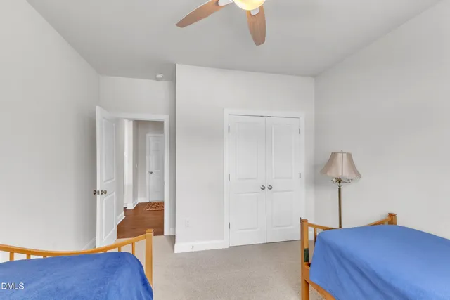 a living room with a bed furniture and a window