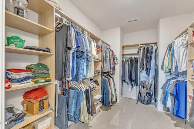 a bathroom with a double vanity sink and mirror