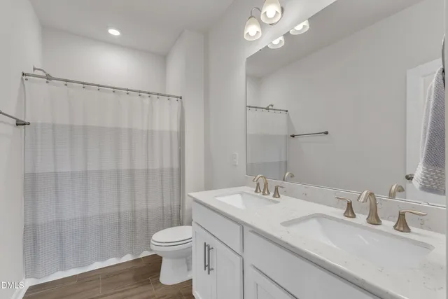 a view of walk in closet with clothes