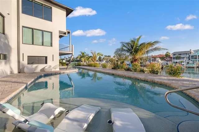 a front view of a building with a garden