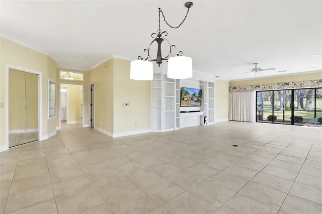 a view of a kitchen with a sink and a chandelier
