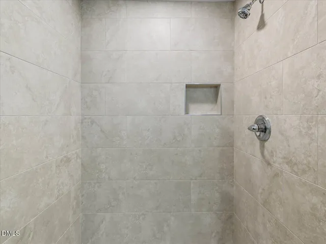 an empty room with closet area