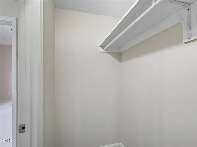 a view of a hallway with a door