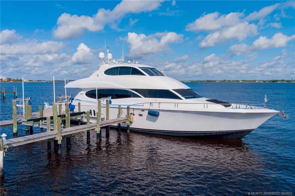 1455 Southeast Riverside Drive Stuart, FL 34996 - Photo 72 of 100 Seating platform and two lifts enhance the dock where this 80' Lazzara is waiting for its passengers