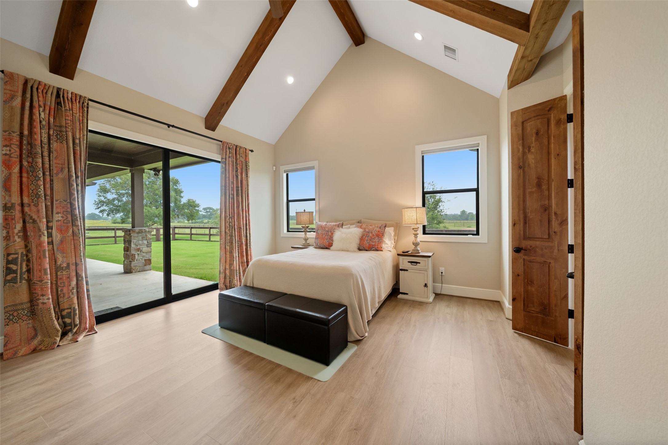 30163 High Spirit Ranch Road Hempstead, TX 77445 - Photo 22 of 49 a spacious bedroom with a bed and large window