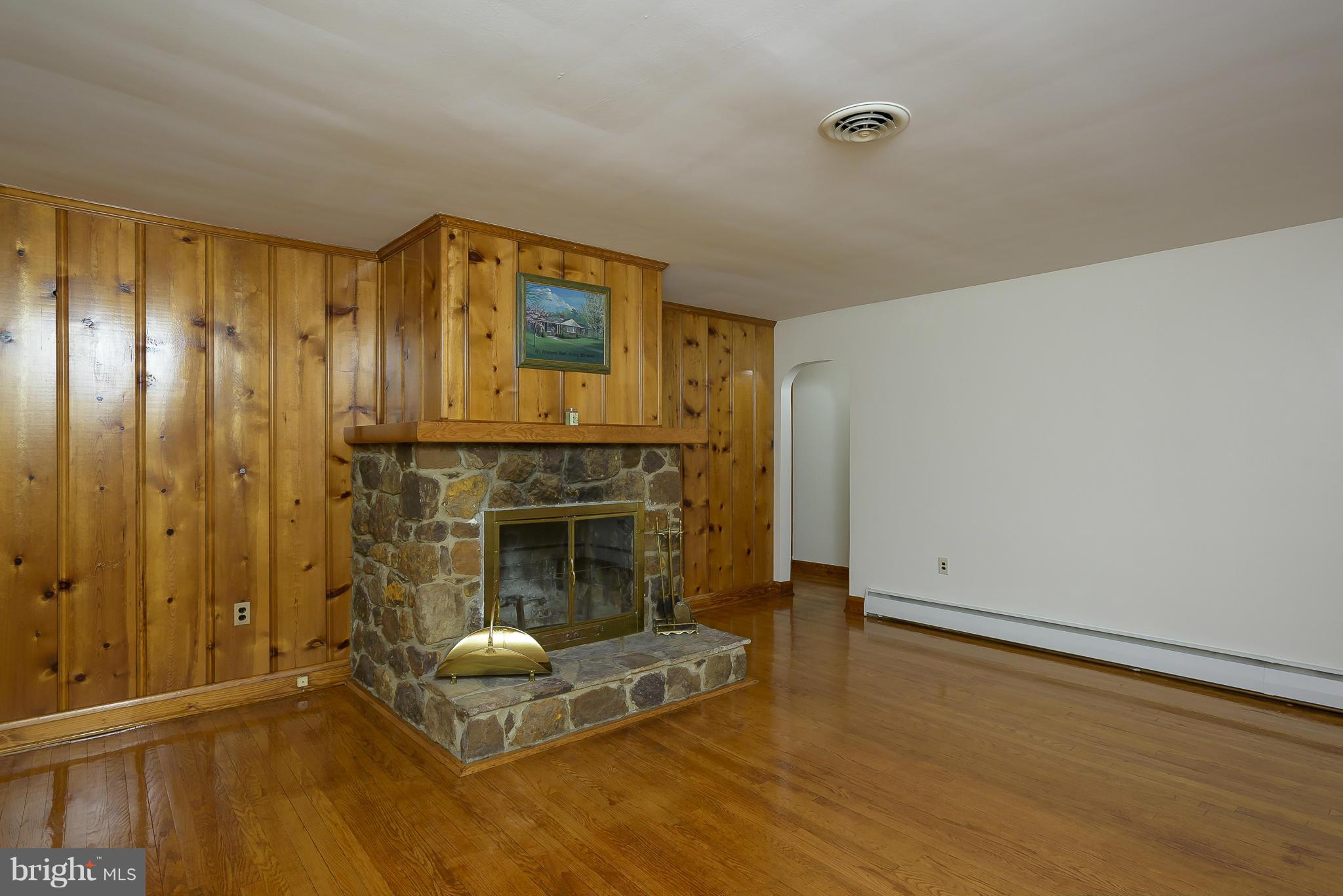 871 Elmhurst Road Severn, MD 21144 - Photo 3 of 28 a living room with a fireplace
