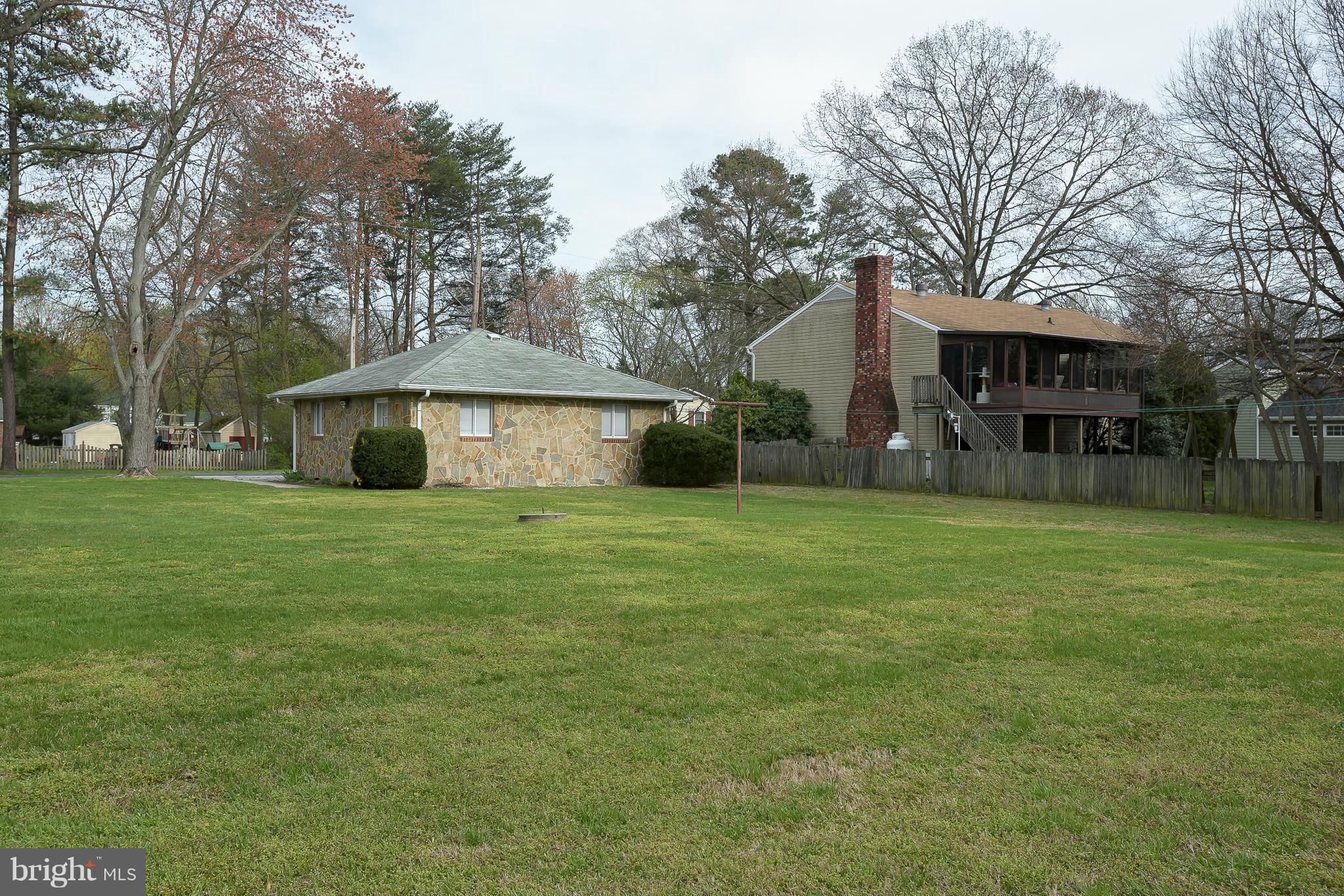 871 Elmhurst Road Severn, MD 21144 - Photo 22 of 28 a front view of house with yard and trees