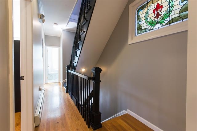 40 47th Street, Unit 2 Weehawken, NJ 07086 - Photo 2 of 8 a view of a hallway with wooden floor and stairs