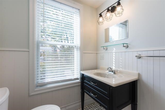 40 47th Street, Unit 2 Weehawken, NJ 07086 - Photo 7 of 8 a bathroom with a sink and a mirror
