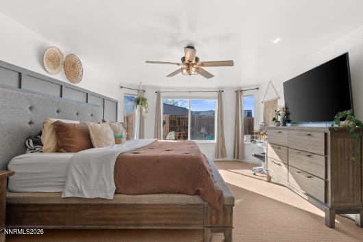 552 Spur Court Fernley, NV 89408 - Photo 22 of 46 a bedroom with a bed and a flat screen tv