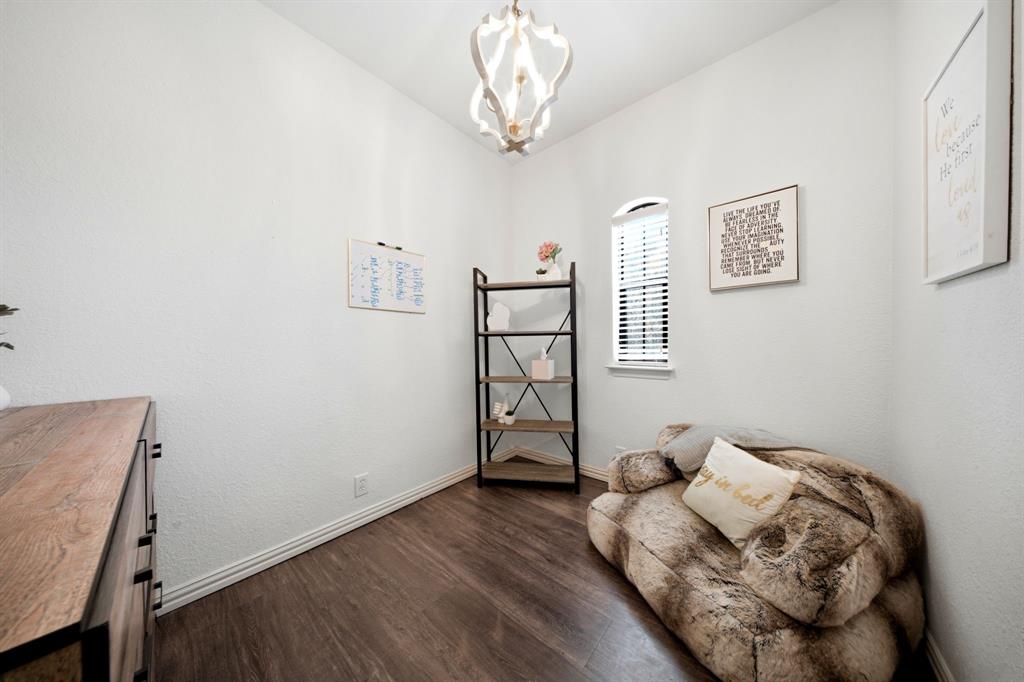 600 Aspen Street Pilot Point, TX 76258 - Photo 27 of 39 Room featuring white walls and wood-finish flooring