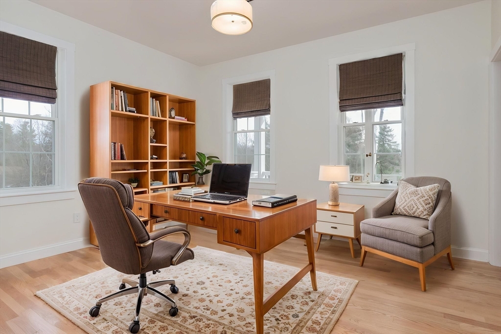76 Robin Hill Road Groton, MA 01450 - Photo 14 of 42 a view of a workspace with furniture and a window