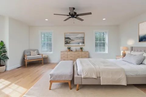 a bedroom with a bed and a couch