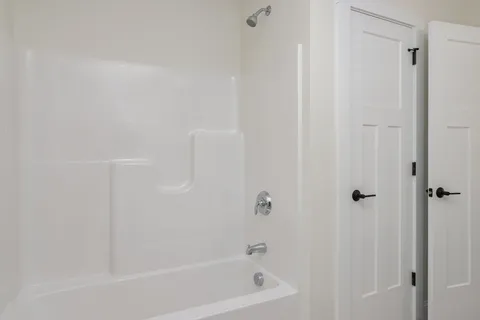 a close up of a bathtub curtain