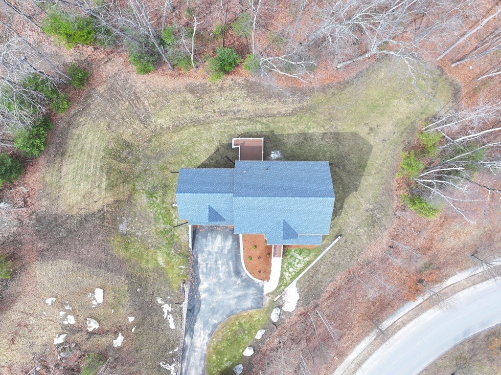 76 Robin Hill Road Groton, MA 01450 - Photo 37 of 42 an aerial view of a house with a yard