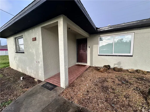 a house view with a backyard