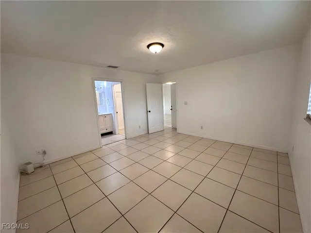 a view of an empty room and window