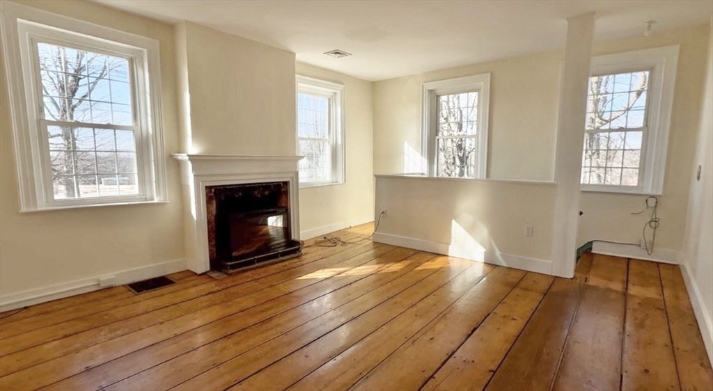 278 East Main Street Plainfield, MA 01070 - Photo 11 of 33 a view of empty room with wooden floor and fireplace