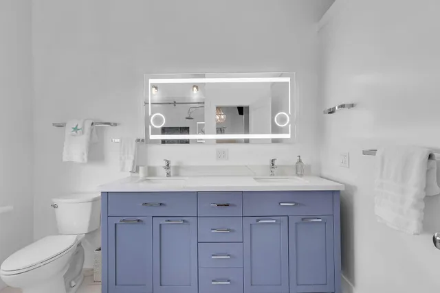 a living room with furniture and a wall painting