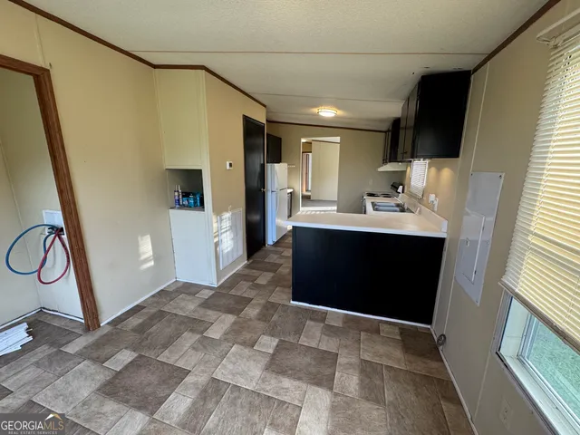 a view of hallway with a large mirror