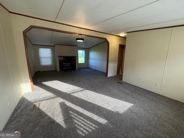 a view of front of house with a yard