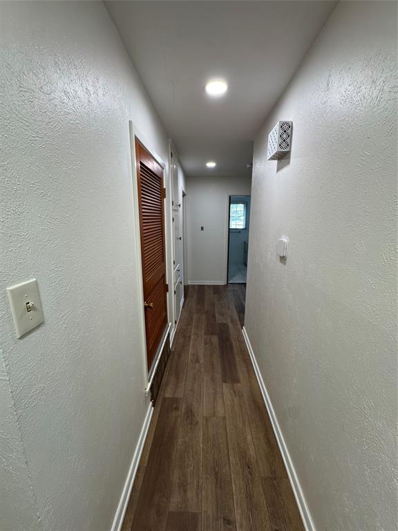 1148 Simpson Drive Hurst, TX 76053 - Photo 17 of 17 a view of hallway with wooden floor