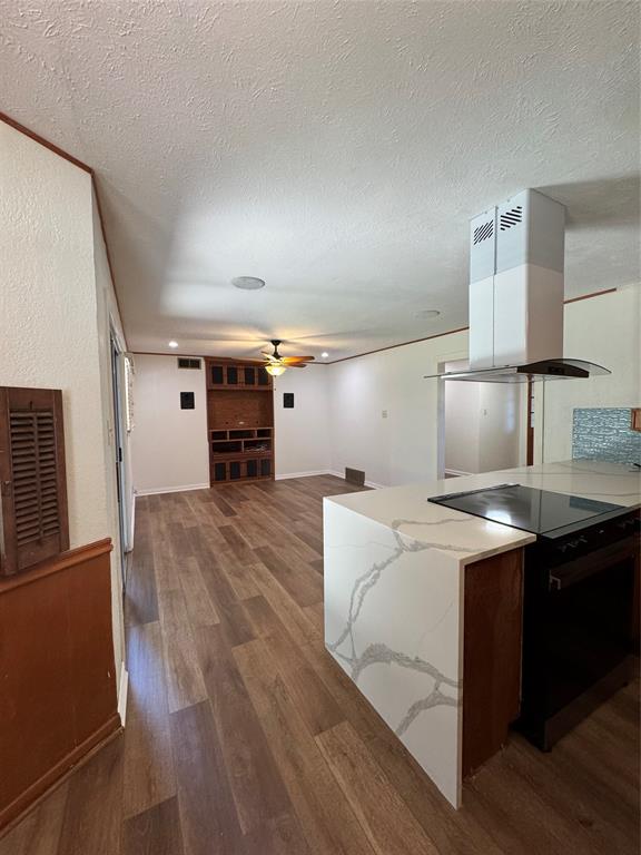 1148 Simpson Drive Hurst, TX 76053 - Photo 6 of 17 a kitchen with a stove a refrigerator and a sink