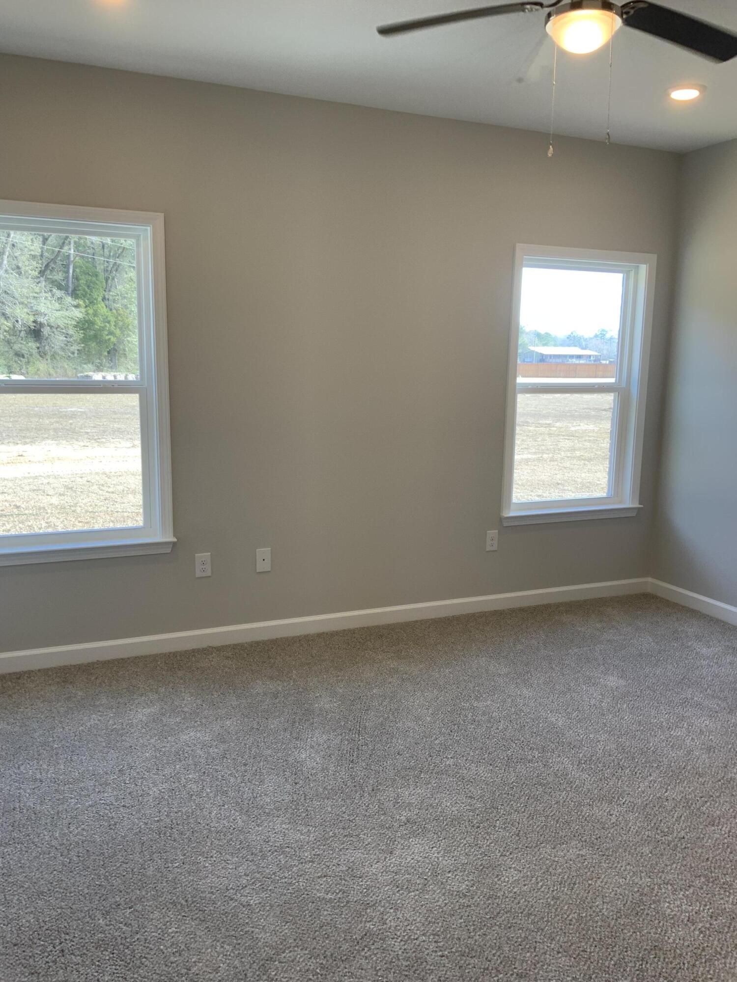 5239 Griffith Mill Road Baker, FL 32531 - Photo 5 of 9 an empty room with windows