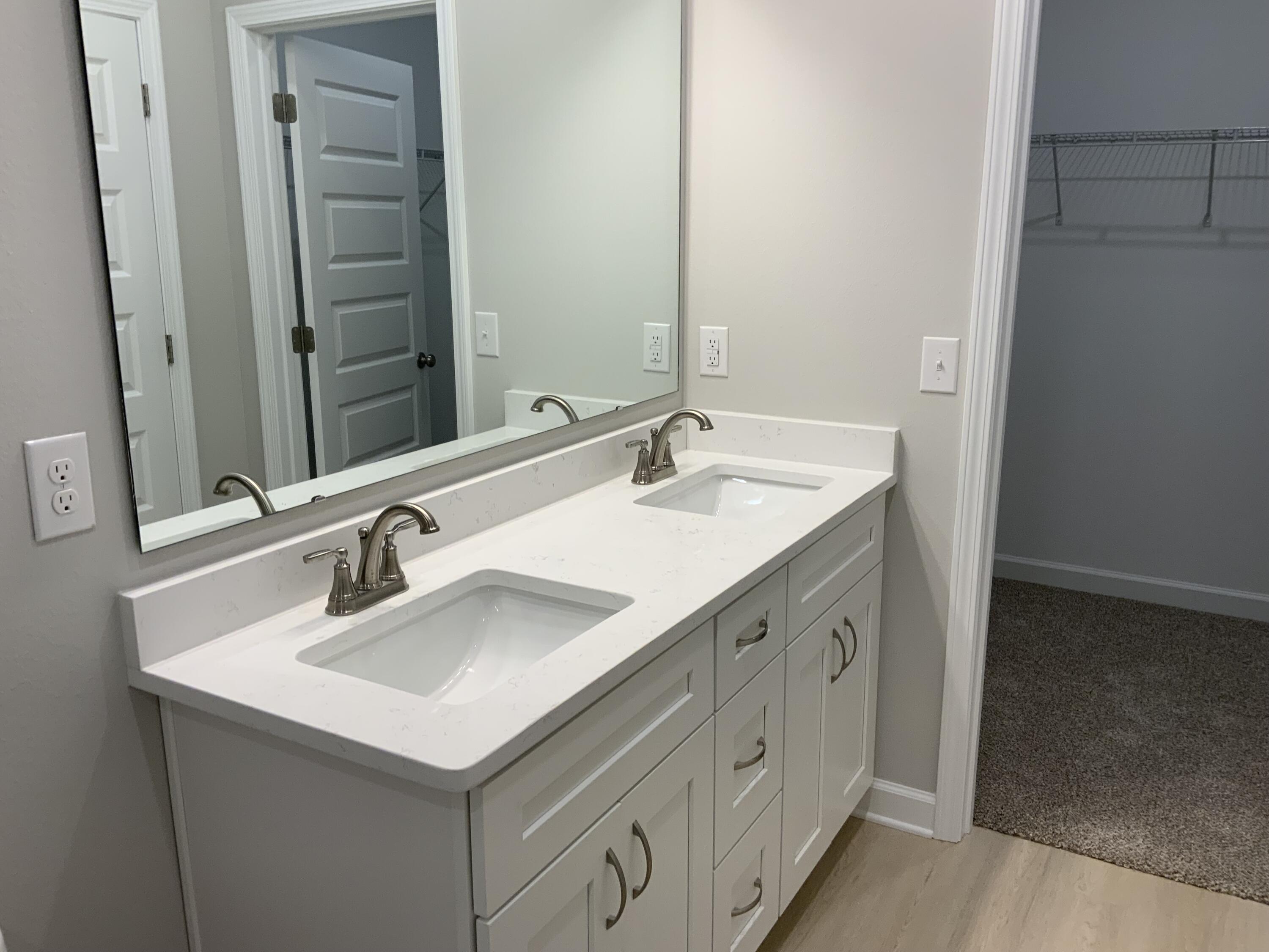 5239 Griffith Mill Road Baker, FL 32531 - Photo 7 of 9 a bathroom with a sink and a mirror