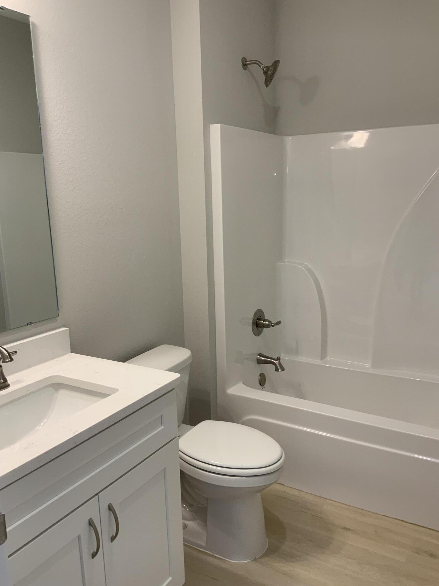 5239 Griffith Mill Road Baker, FL 32531 - Photo 8 of 9 a bathroom with a toilet a sink and a bathtub