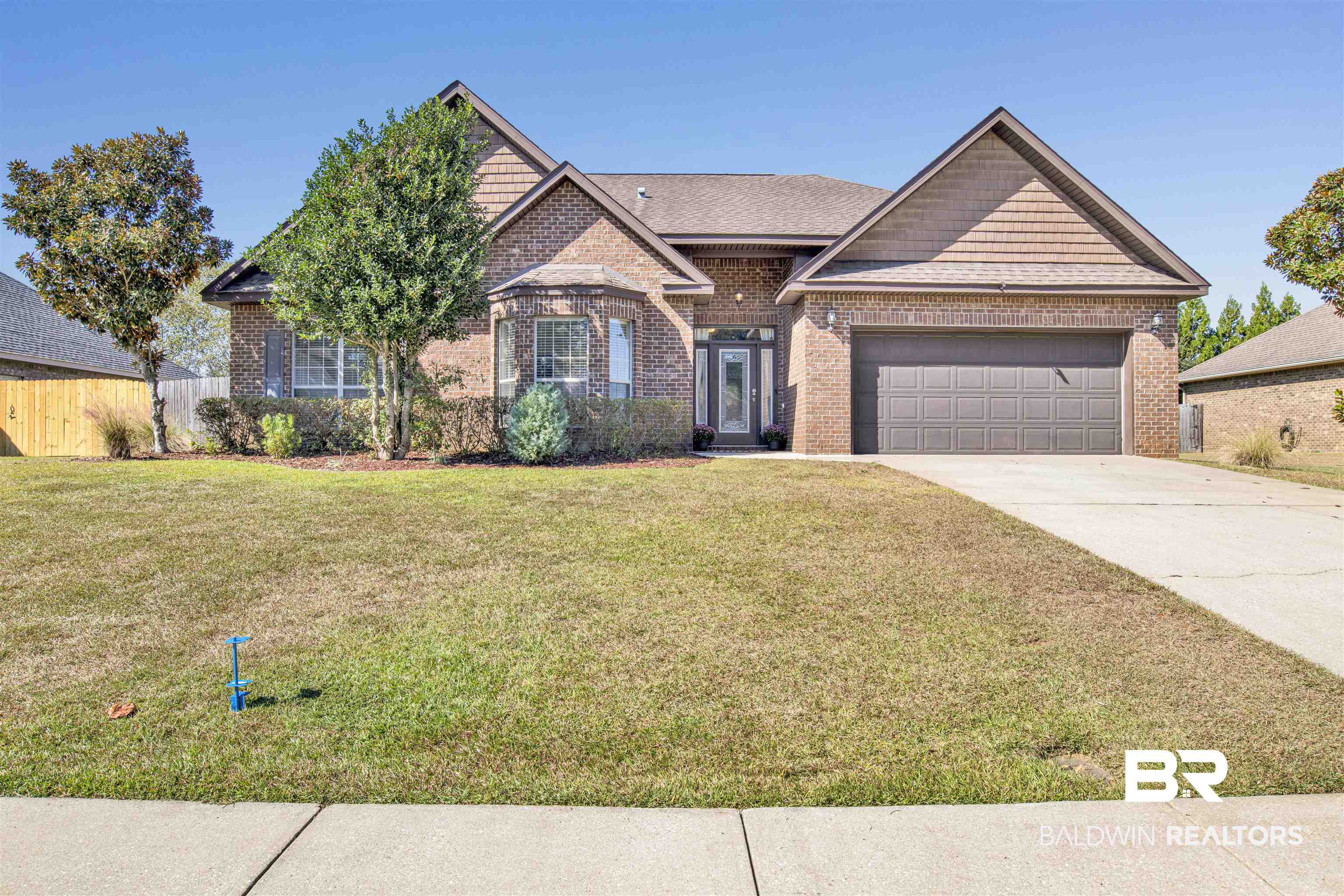 24159 Tullamore Drive Daphne, AL 36526 - Photo 2 of 31 Ranch-style house with a front yard and a garage