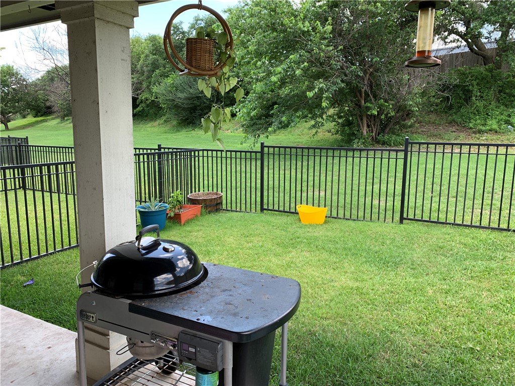 1900 Scofield Ridge Parkway, Unit 1202 Austin, TX 78727 - Photo 2 of 18 Covered back porch with cute fenced in private yard
