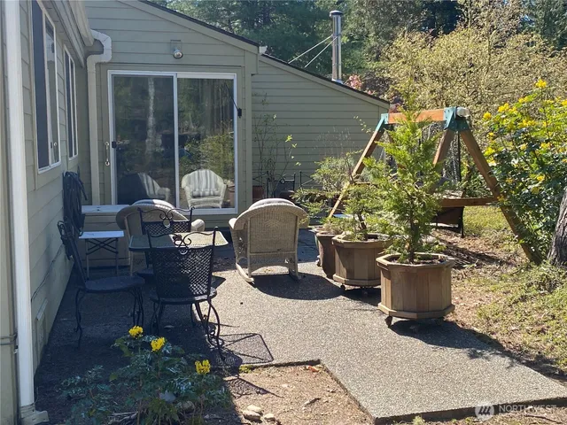 a view of balcony with wooden floor and outdoor seating