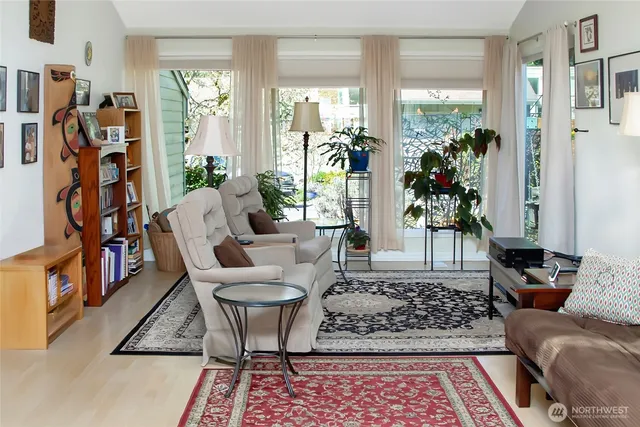a living room with furniture and a rug