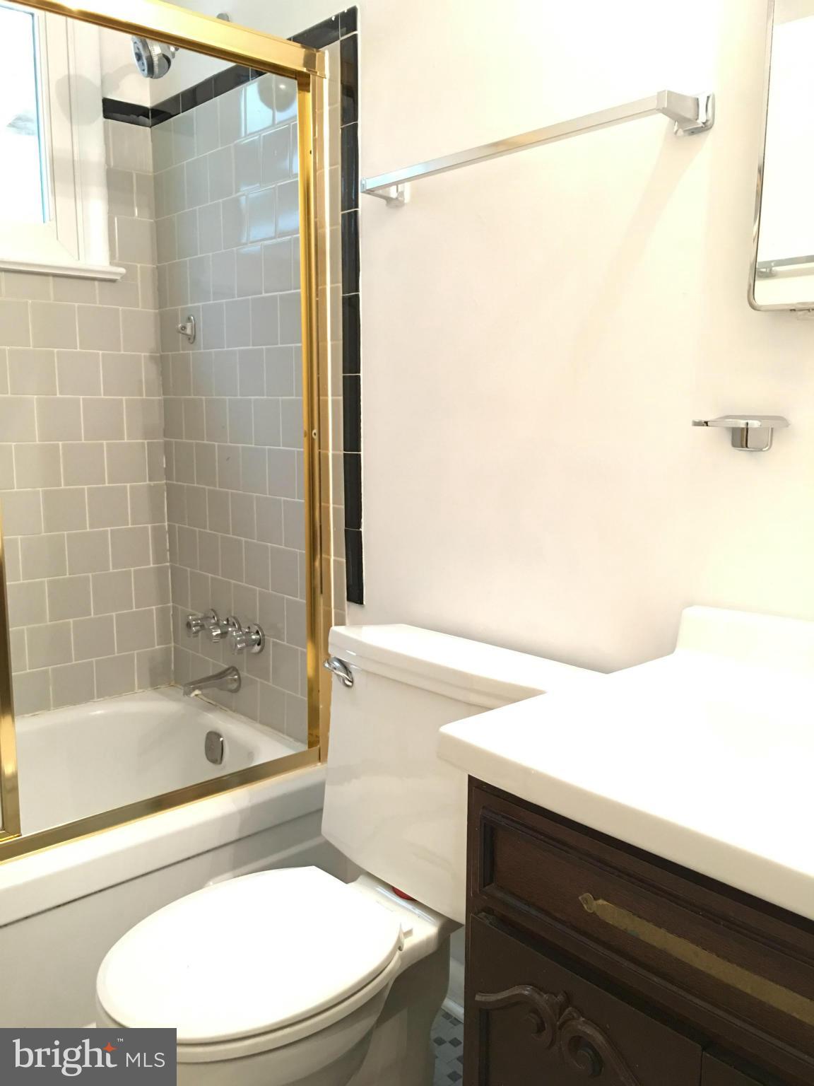 4307 Havard Street Silver Spring, MD 20906 - Photo 23 of 27 a bathroom with a bathtub and a shower