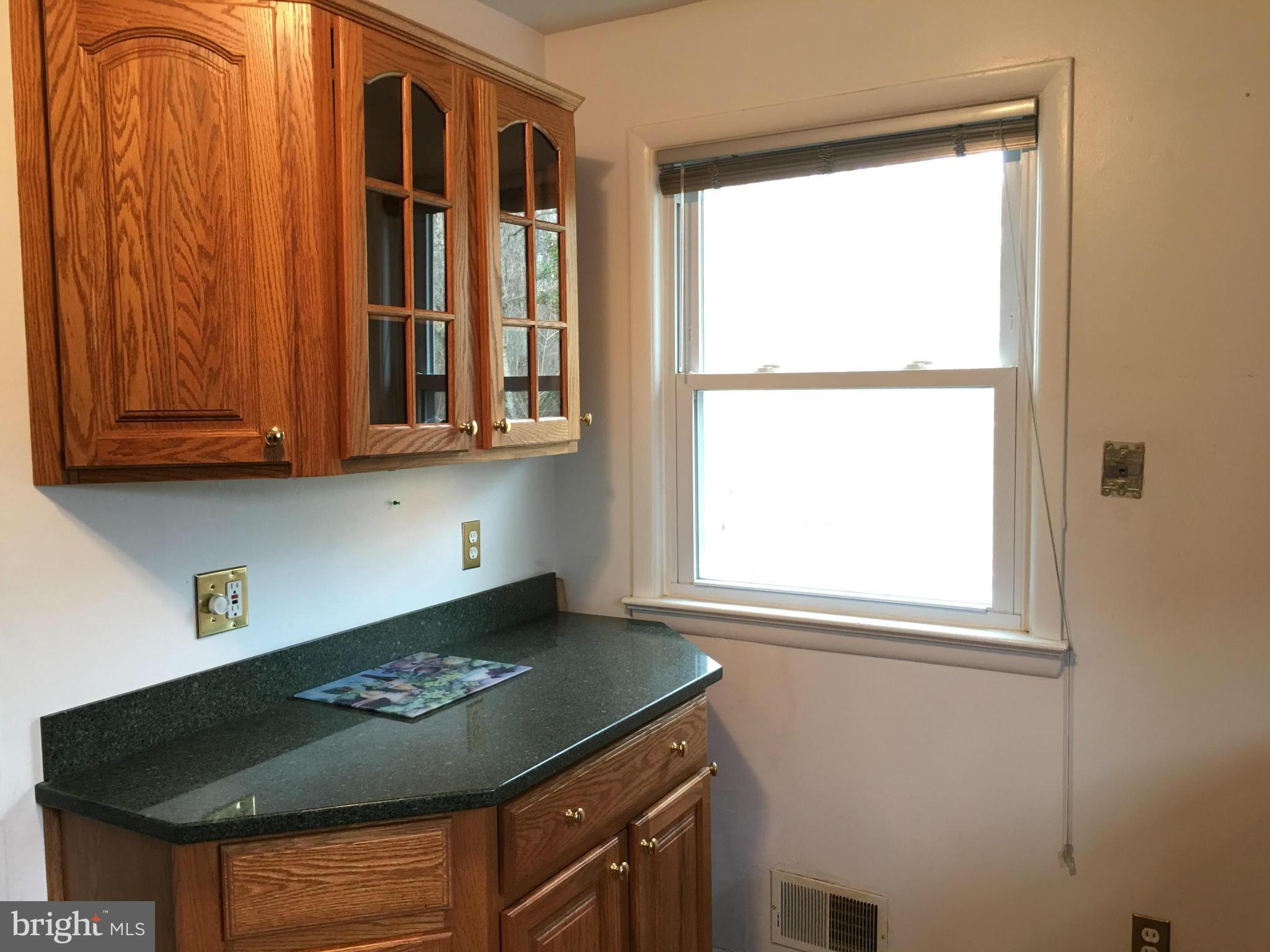 4307 Havard Street Silver Spring, MD 20906 - Photo 4 of 27 a kitchen with stainless steel appliances granite countertop a stove and a microwave