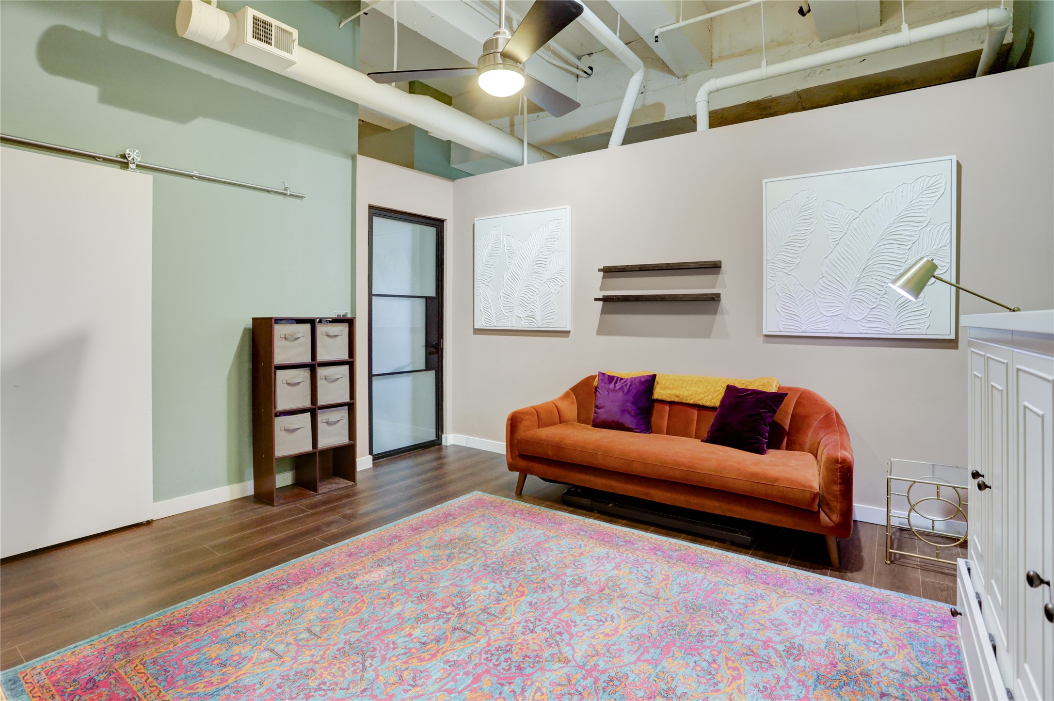 705 Main Street, Unit 419 Houston, TX 77002 - Photo 11 of 25 a living room with furniture and a rug