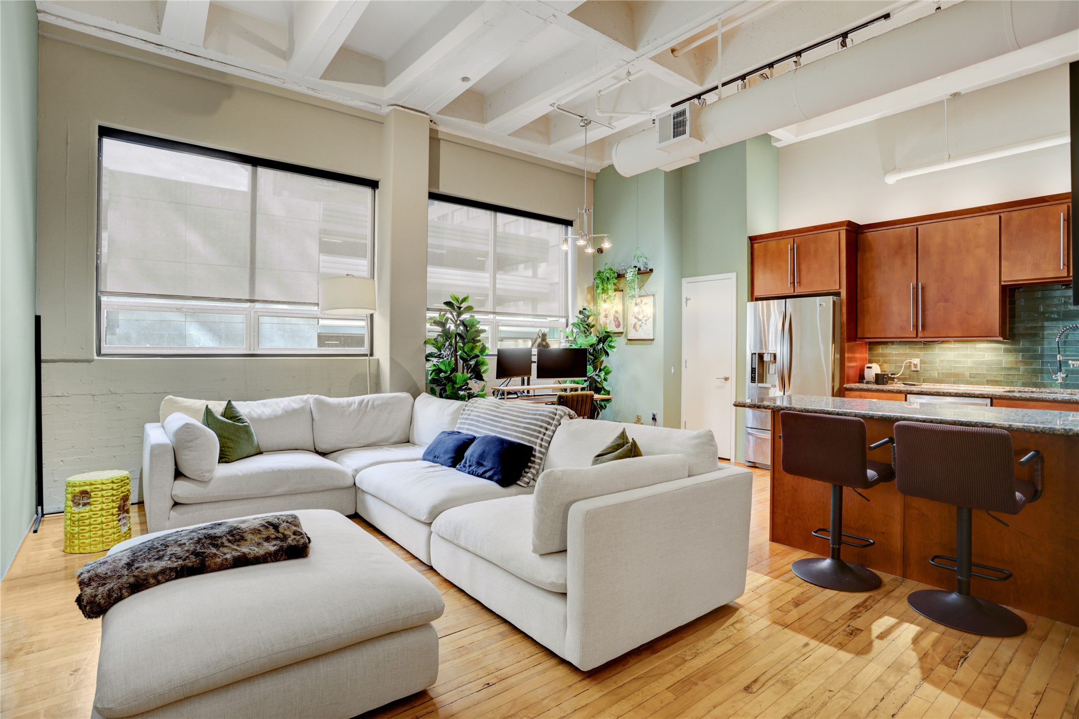705 Main Street, Unit 419 Houston, TX 77002 - Photo 2 of 25 a living room with furniture and a large window