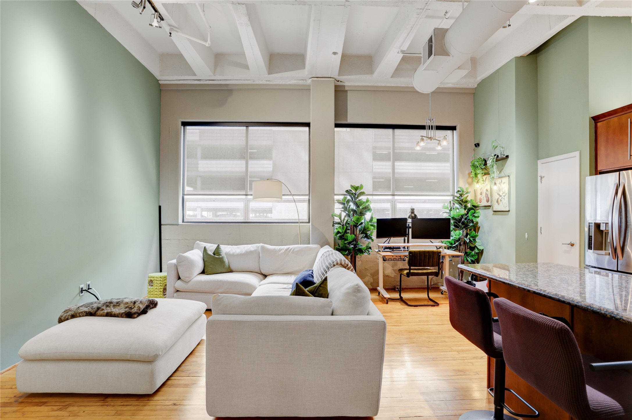 705 Main Street, Unit 419 Houston, TX 77002 - Photo 4 of 25 a living room with furniture and a large window