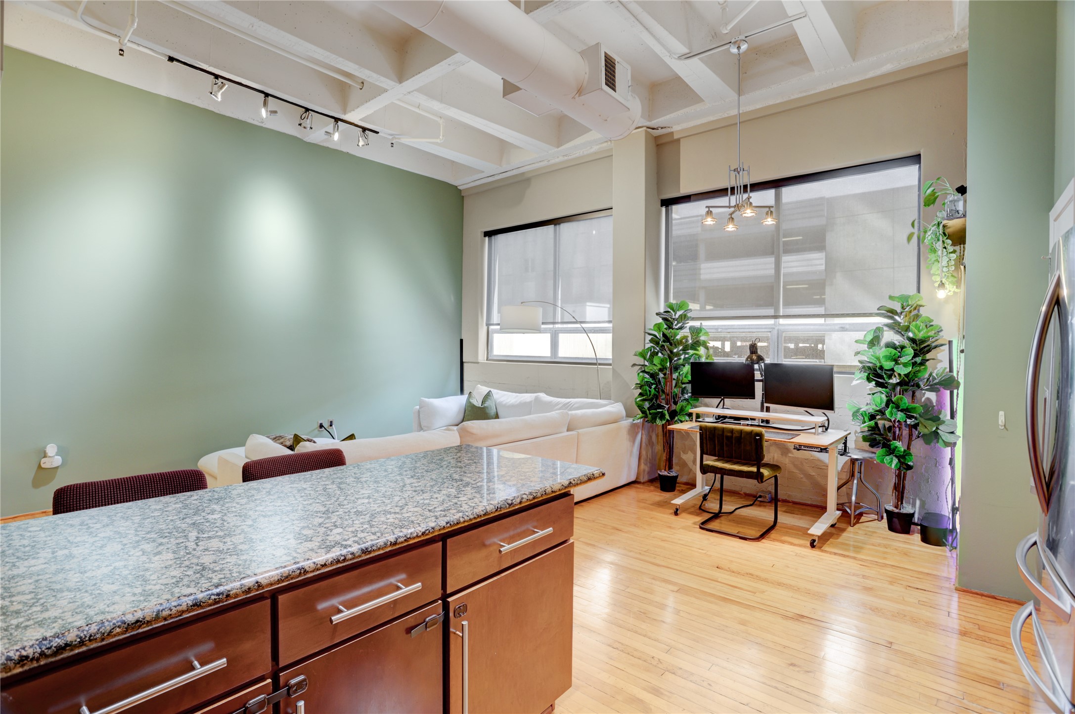 705 Main Street, Unit 419 Houston, TX 77002 - Photo 6 of 25 a hallway with a table and chairs in it