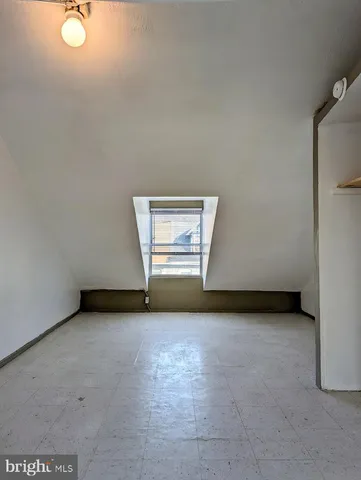 an empty room with a empty space and window