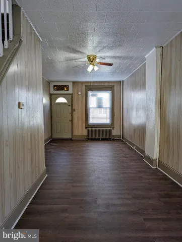 a view of a livingroom with wooden floor