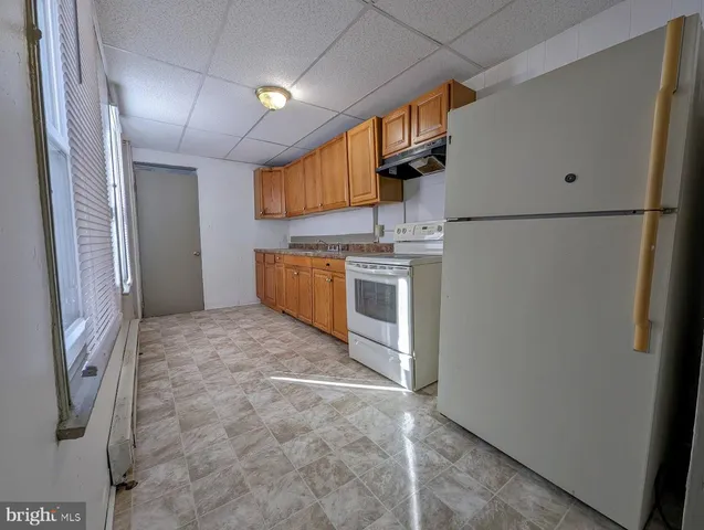 a view of a kitchen with a sink