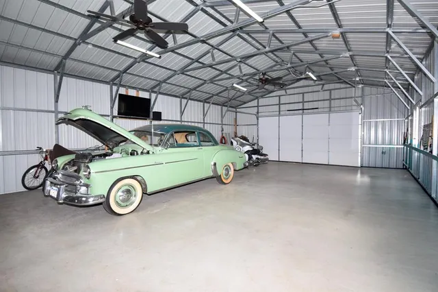 a view of a garage and car parked