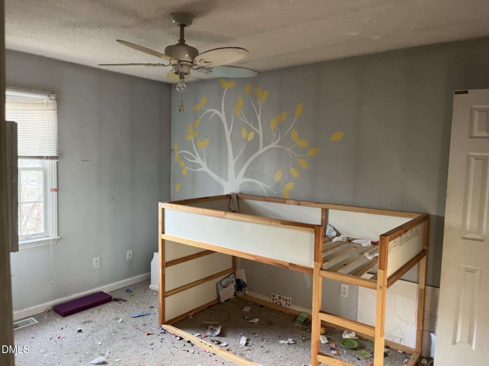 370 Sanders Road Benson, NC 27504 - Photo 11 of 13 a room with chandelier fan and windows
