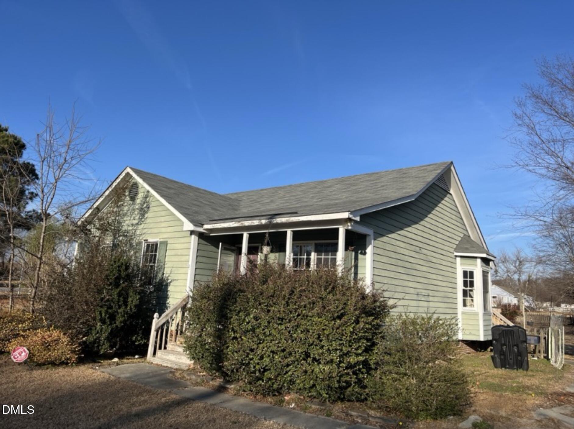370 Sanders Road Benson, NC 27504 - Photo 2 of 13 a front view of a house with garden